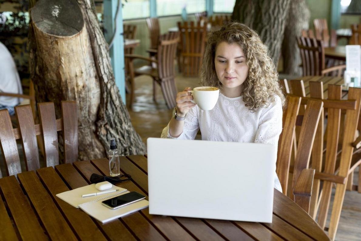 Financial analyst reviewing detailed Excel models on dual monitors in professional office environment